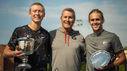 ITA All-American Singles champion Ethan Quinn, runner-up Philip Henning and Georgia men's tennis head coach Manny Diaz posting after the singles finals.
