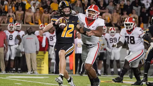 Oct 1, 2022; Columbia, Missouri, USA; Missouri Tigers quarterback Brady Cook (12) is sacked by Georgia Bulldogs linebacker Nolan Smith (4) during the second half at Faurot Field at Memorial Stadium. Mandatory Credit: Denny Medley-USA TODAY Sports