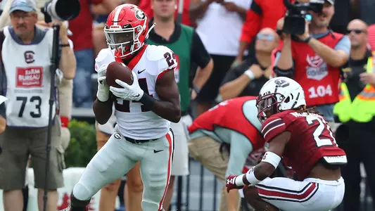 Georgia defensive back Malaki Starks intercepts a pass intended for South Carolina running back Juju McDowell during the first half of an NCAA college football game, Saturday, Sept. 17, 2022, in Columbia, S.C. (Curtis Compton/Atlanta Journal-Constitution via AP)