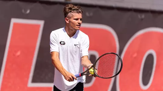 Britton Johnston preparing to serve at a practice in September, 2022.