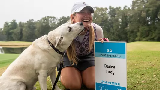 DOTHAN, AL - DECEMBER 11: Bailey Tardy of the United States and her dog Ramsey pose with her tour card after the final round of the 2022 LPGA Q-Series - Dothan at Highland Oaks Golf Course on December 11, 2022 in Dothan, Alabama. (Photo by Hannah Ruhoff/Getty Images)