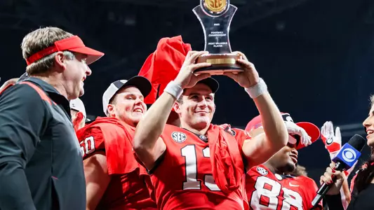 22FB Stetson Bennett holds up the SEC Championship MVP trophy