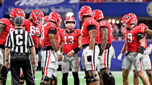Georgia quarterback Stetson Bennett (13) and offensive huddle during the Bulldogsâ?? 50-30 win over LSU in the 2022 SEC Championship game played December 3, 2022, at Mercedes-Benz Stadium in Atlanta, GA. Photo credit Perry McIntyre.