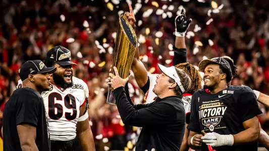 Coach Kirby Smart celebrates with the National Championship trophy