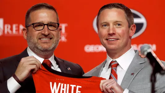 New Georgia basketball coach Mike White, right, poses for a photo with Georgia director of athletics Josh Brooks while being introduced as the men's basketball coach at the University of Georgia in Athens, Ga., on Tuesday, March 15, 2022.