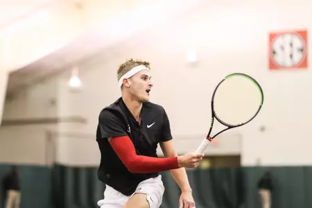 Georgia tennis player Hamish Stewart during a match against South Carolina at Lindsey Hopkins Indoor Tennis Stadium in Athens, Ga., on Sunday, March 13, 2022. (Photo by Mackenzie Miles)