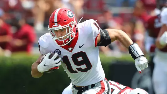 Georgia tight end Brock Bowers puts a move on a South Carolina defender on his way to the end zone for a 70-plus yard touchdown reception, his third touchdown of the day, during the third quarter of a NCAA college football game in Columbia, S.C., Saturday, Sept. 17, 2022. (Curtis Compton/Atlanta Journal-Constitution via AP)