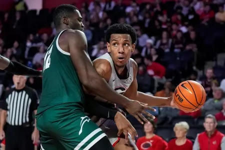 Dec 7, 2021; Athens, Georgia, USA; Georgia Bulldogs guard Braelen Bridges (23) is defended by Jacksonville Dolphins forward Mike Marsh (12) during the second half at Stegeman Coliseum. Mandatory Credit: Dale Zanine-USA TODAY Sports