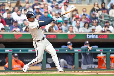 MINNEAPOLIS, MN - APRIL 09: Minnesota Twins shortstop Kyle Farmer (12) takes a swing during the MLB game between Houston Astros and Minnesota on April 9th, 2023, at Target Field in Minneapolis. (Photo by Bailey Hillesheim/Icon Sportswire via Getty Images)