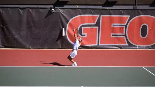 Miguel Perez Peña serving in the red draw singles finals at the Southern Intercollegiate Championships.