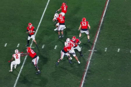 Georgia quarterback Carson Beck (15), Georgia wide receiver Dillon Bell (86), Georgia tight end Brock Bowers (19), Georgia offensive lineman Earnest Greene III (71), Georgia offensive lineman Dylan Fairchild (53), Georgia offensive lineman Sedrick Van Pran (63), Georgia offensive lineman Tate Ratledge (69), Georgia offensive lineman Amarius Mims (65) during Georgia’s game against Ole Miss on Dooley Field at Sanford Stadium in Athens, Ga., on Saturday, Nov. 11, 2023. (Tony Walsh/UGAAA)