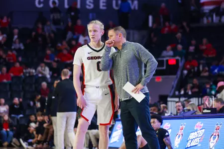 Georgia guard Blue Cain (0), Georgia head coach Mike White during Georgia’s game against Winthrop University at Stegeman Coliseum in Athens, Ga., on Friday, Nov. 24, 2023. (Cassie Baker/UGAAA)