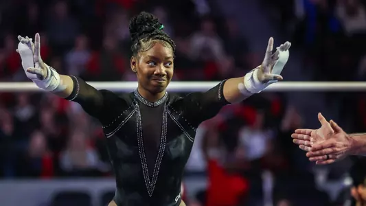 JaFree Scott after performing on unbalanced bars during the team's meet against Alabama on Feb. 17, 2023.