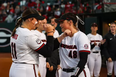 Georgia catcher and first baseman Lyndi Rae Davis (11), Georgia pitcher Shelby Walters (48) during the SEC opener game against Auburn at Turner Sports Complex in Athens, Ga., on Friday, March 10, 2023. (Kayla Renie/UGAAA)
