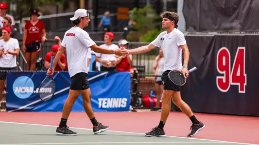 Blake Croyder and Britton Johnston celebrating a point during the team's Super Regional match against Harvard on May 13, 2023.