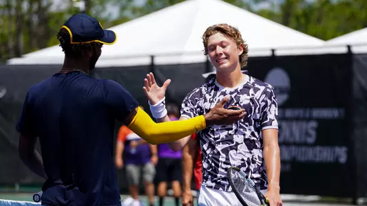 Ethan Quinn shaking hands with Andrew Fenty following his 6-2, 6-4 win in the NCAA Singles Championships quarterfinals on May 25, 2023.