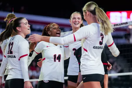 Georgia outside hitter Erykah Lovett (14), Georgia middle blocker Sophie Fischer (2) during Georgia’s match against Ole Miss at Stegeman Coliseum in Athens, Ga., on Sunday, Oct. 13, 2024. (Tony Walsh/UGAAA)