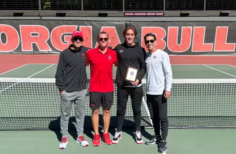 Miguel Perez Pena with head coach Jamie Hunt, associate head coach Bryce Warren and assistant coach Bruno Tiberti after the ITA Southeast Regional on Sunday, Oct. 20.