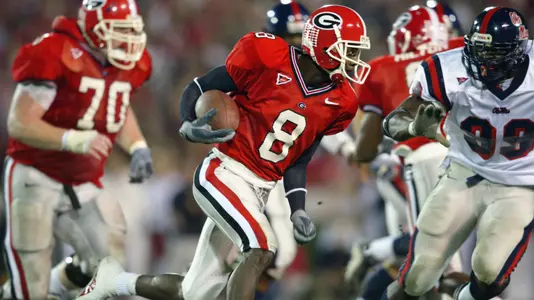 ATHENS, GA - NOVEMBER 9:  Flanker Terrence Edwards #8 the University of Mississippi Rebels carries the ball against the University of Georgia Bulldogs during the SEC game at Sanford Stadium on November 9, 2002 in Athens, Georgia.  Georgia won 31-17.  (Photo by Jamie Squire/Getty Images)