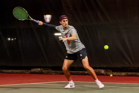 Oscar Pinto Sansano during a doubles match at the Dan Magill Tennis Complex.