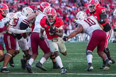 Nov 23, 2024; Athens, Georgia, USA; Georgia Bulldogs running back Nate Frazier (3) scores a touchdown against the Massachusetts Minutemen during the second half at Sanford Stadium. Mandatory Credit: Dale Zanine-Imagn Images