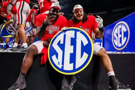 Georgia defensive lineman Nazir Stackhouse (78), Georgia defensive lineman Tyrion Ingram-Dawkins (93) after Georgia’s game against Texas in the 2024 SEC Championship at Mercedes-Benz Stadium in Atlanta, Ga., on Saturday, Dec. 7, 2024. (Conor Dillon/UGAAA)