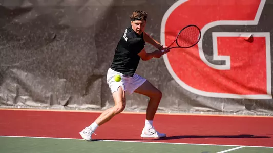 Freddy Blaydes in the midst of a rally during the team's match against No. 3 Wake Forest on Monday, Feb. 26, 2024.