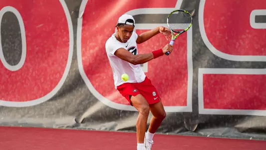 Niels Ratiu returning a shot during the team's match against Texas.