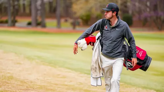 Beck Burnette during the first round of the Linger Longer Invitational heading to his next shot.