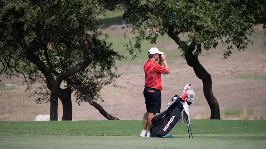 Buck Brumlow looking out to gauge distance on a shot at the Valero Texas Collegiate.
