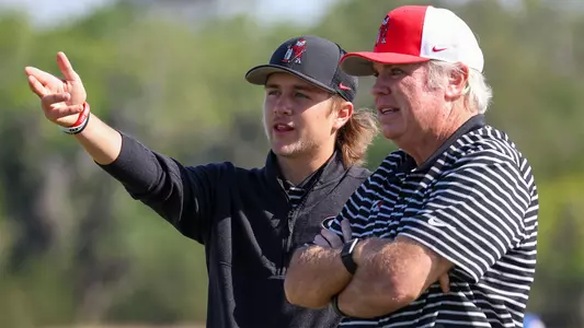 Freshman Camden Smith and associate head coach Jim Douglas discussing a shot during the first round of the SEC Championships on April 24, 2024.