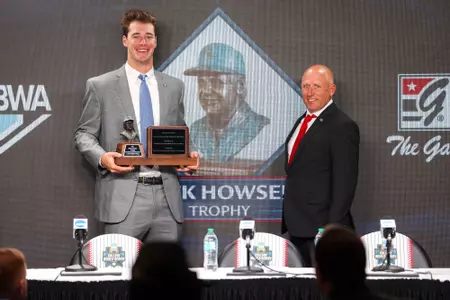 Charlie Condon and Ike Cousins Head Baseball Coach Wes Johnson during the Dick Howser Award Press Conference at Charles Schwab Field in Omaha, Ne., on Friday, June 14, 2024. (Kari Hodges/UGAAA)