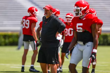 John and Alice Sands offensive coordinator and quarterbacks coach Mike Bobo at fall practice