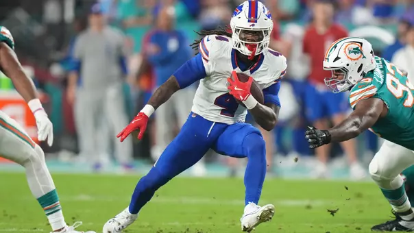 MIAMI GARDENS, FL - SEPTEMBER 12: Buffalo Bills running back James Cook (4) rushes with the ball during the game between the Buffalo Bills and the Miami Dolphins on Thursday, September 12, 2024 at Hard Rock Stadium in Miami Gardens, Fla. (Photo by Peter Joneleit/Icon Sportswire via Getty Images)