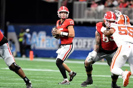 ATLANTA, GEORGIA - AUGUST 31: Carson Beck #15 of the Georgia Bulldogs looks to pass the ball during a game between Clemson University and University of Georgia at Mercedes-Benz Stadium on August 31, 2024 in ATLANTA, GA. Photo credit Perry McIntyre