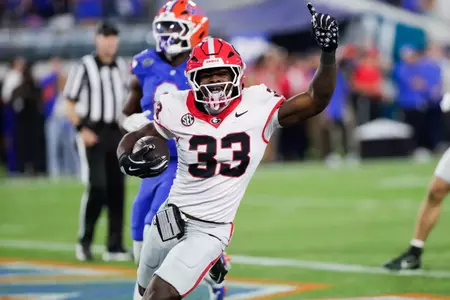 Nov 1, 2025; Jacksonville, Florida, USA; Georgia Bulldogs running back Chauncey Bowens (33) runs the ball for a touchdown in the second half against the Florida Gators at EverBank Stadium. Mandatory Credit: Travis Register-Imagn Images