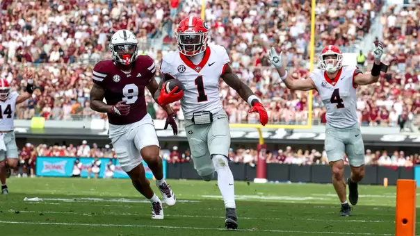Nov 8, 2025; Starkville, Mississippi, USA; Georgia Bulldogs wide receiver Zachariah Branch (1) runs with the ball for a touchdown against the Mississippi State Bulldogs during the first half at Davis Wade Stadium at Scott Field. Mandatory Credit: Wesley Hale-Imagn Images