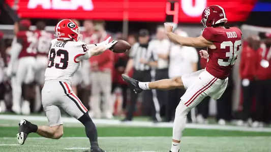 Dec 6, 2025; Atlanta, GA, USA; Georgia Bulldogs wide receiver Cole Speer (83) blocks a punt from Alabama Crimson Tide punter Blake Doud (38) during the first quarter during the 2025 SEC Championship game at Mercedes-Benz Stadium. Mandatory Credit: Brett Davis-Imagn Images