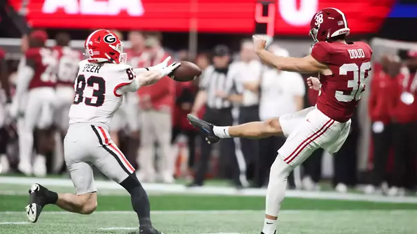 Dec 6, 2025; Atlanta, GA, USA; Georgia Bulldogs wide receiver Cole Speer (83) blocks a punt from Alabama Crimson Tide punter Blake Doud (38) during the first quarter during the 2025 SEC Championship game at Mercedes-Benz Stadium. Mandatory Credit: Brett Davis-Imagn Images