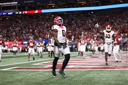 Dec 6, 2025; Atlanta, GA, USA; Georgia Bulldogs running back Roderick Robinson II (0) celebrates after scoring a touchdown during the first quarter against the Alabama Crimson Tide during the 2025 SEC Championship game at Mercedes-Benz Stadium. Mandatory Credit: Brett Davis-Imagn Images