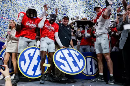 Georgia outside linebacker Quintavius Johnson (33), Georgia defensive back Ellis Robinson IV (1), Georgia head coach Kirby Smart after Georgia’s game against Alabama in the 2025 SEC Championship at Mercedes-Benz Stadium in Atlanta, Ga., on Saturday, Dec. 6, 2025. (Conor Dillon/UGAAA)