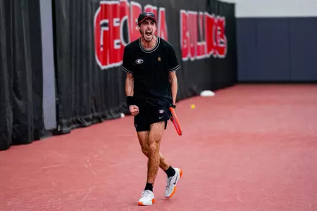 Senior Thomas Paulsell during a singles match in the Lindsey Hopkins Indoor Facility.