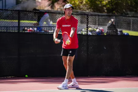 Senior Thomas Paulsell during a singles match.