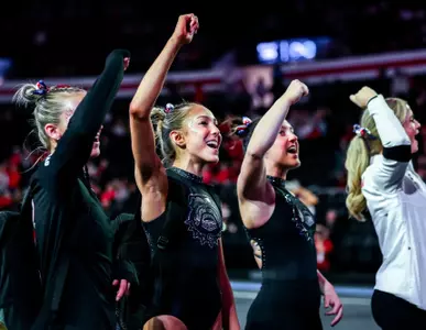 Gymnasts Lily Smith and Ady Wahl cheer at GymDog meet.