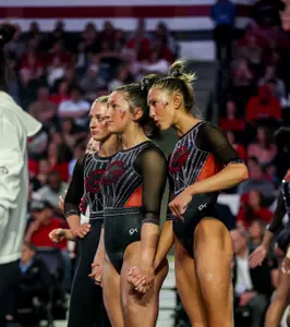 Gymnasts Ady Wahl and Lily Smith watch the meet.