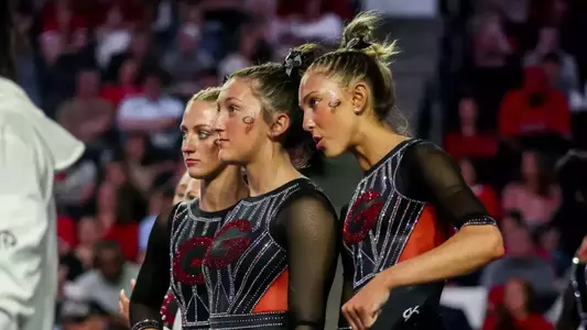 Gymnasts Ady Wahl and Lily Smith watch the meet.