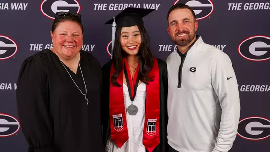2025 spring graduation shot of Erika Brennan, Kate Song and Dalton Stevens (photo by Tony Walsh).