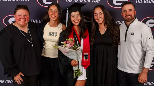 Graduation 2025 women's golf shot (photo by Tony Walsh).