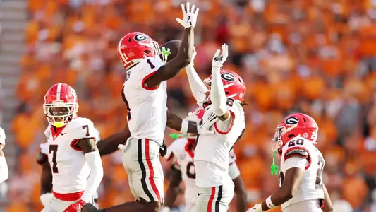 NCAA Football: Georgia at Tennessee - Sep 13, 2025; Knoxville, Tennessee, USA; Georgia Bulldogs defensive back Joenel Aguero (8) celebrates after a play with teammates during the second half against Tennessee Volunteers at Neyland Stadium. Mandatory Credit: Alan Poizner-Imagn Images