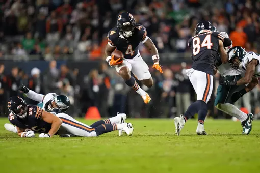 CHICAGO, ILLINOIS - SEPTEMBER 28: D'Andre Swift #4 of the Chicago Bears leaps with the ball during the fourth quarter of the NFL game against the Philadelphia Eagles at Soldier Field on September 28, 2026 in Chicago, Illinois. (Photo by Todd Rosenberg/Getty Images)